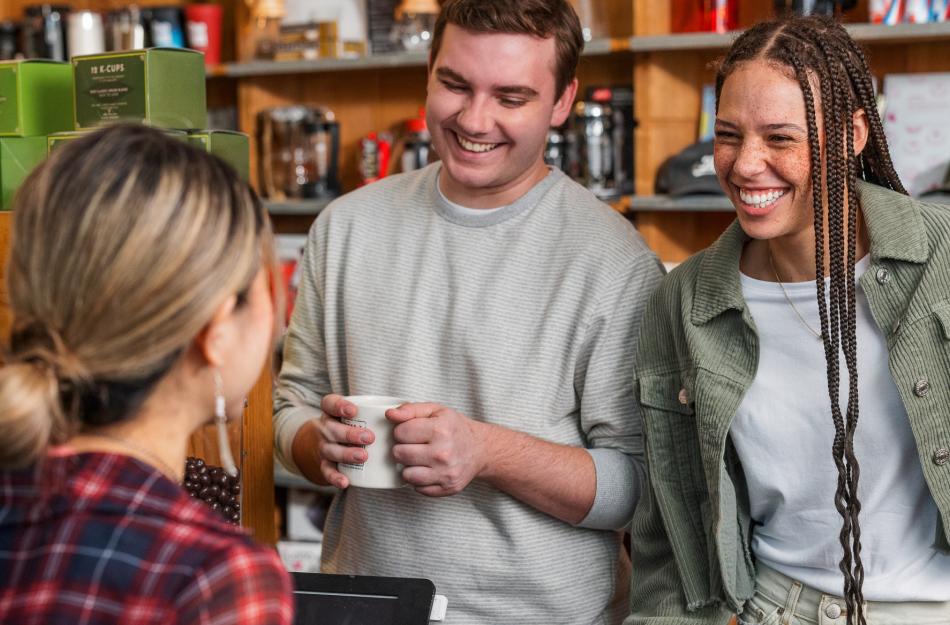 people chatting while getting coffee