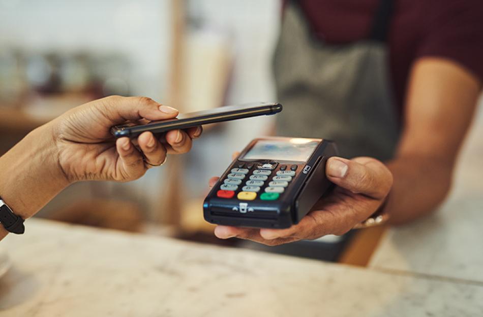 picture of someone paying with their phone