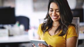 woman looking at her tablet